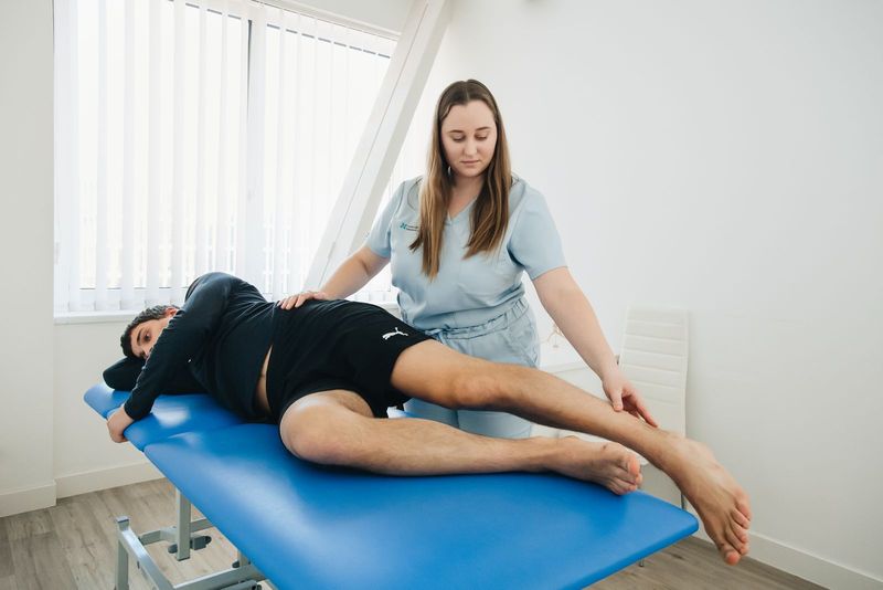 Physiotherapist treating a patient